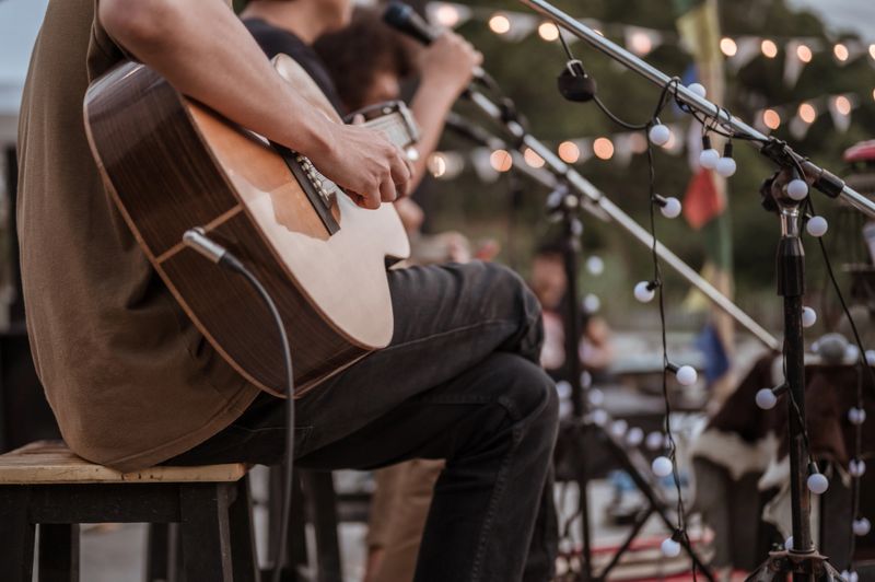 The musician plays and the lead singer sings on stage at the music festival.Concert,mini concert and music festivals.