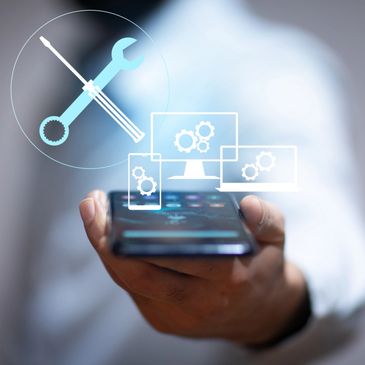 Hand holding smartphone with digital tech support icons floating above.