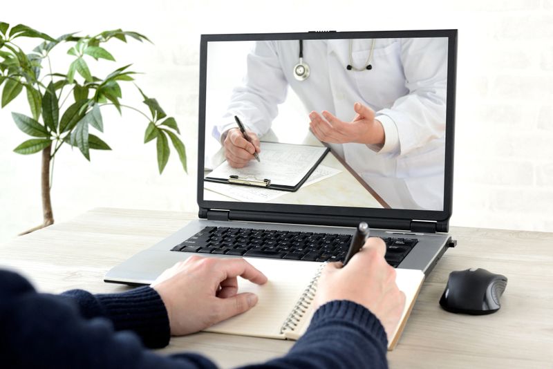 Man taliking with doctor in remote environment