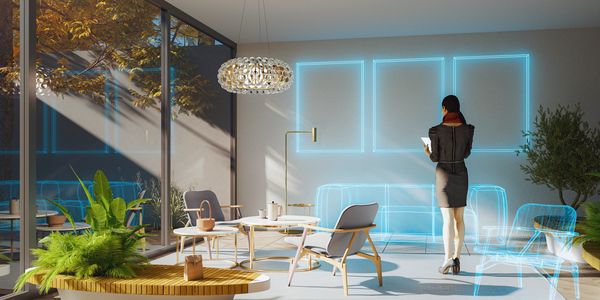 Woman visualizing virtual furniture in a modern sunlit room with large windows.