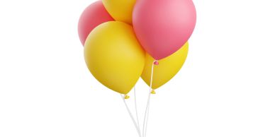 Pink and yellow balloons clustered together.