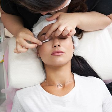 Applying mascara on eyelashes
