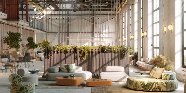 Spacious modern lounge with large windows, greenery, and stylish seating arrangements.