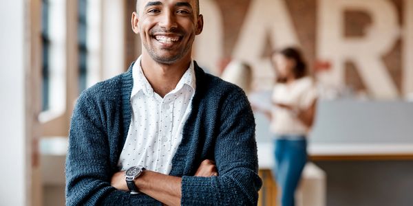 Confident professional representing personal tax preparation, tax planning, and wealth management.