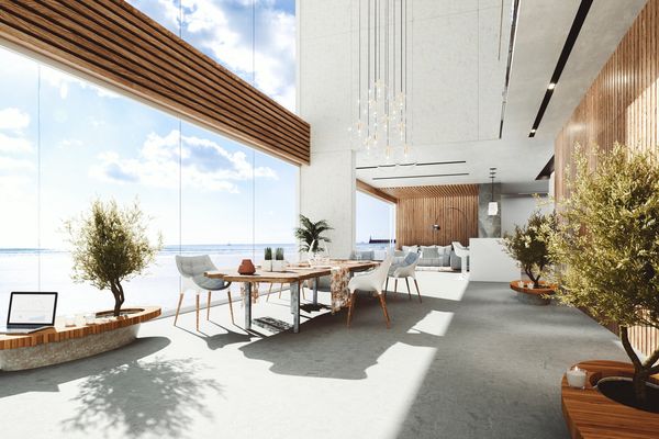 Modern dining space with ocean view and natural light.