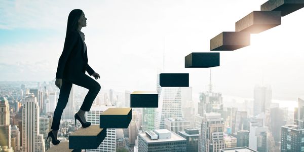 Businesswoman climbing floating stairs above a city skyline, symbolizing career growth.