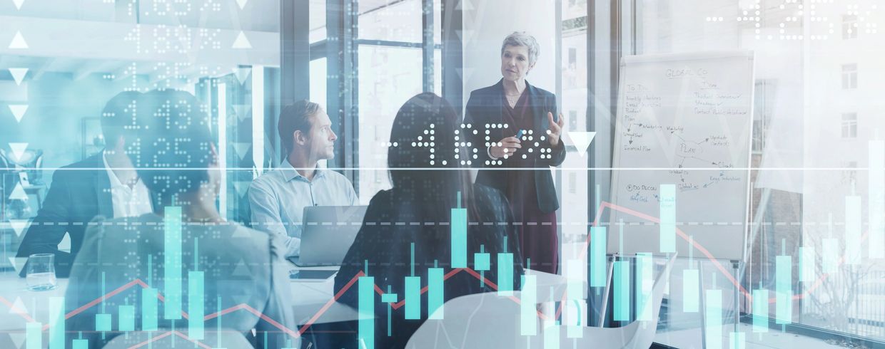 Business team in a meeting with financial data overlays.