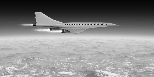Black and white image of a supersonic jet flying above clouds.