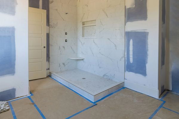 Bathroom being remodeled with new shower, new tile, new drywall