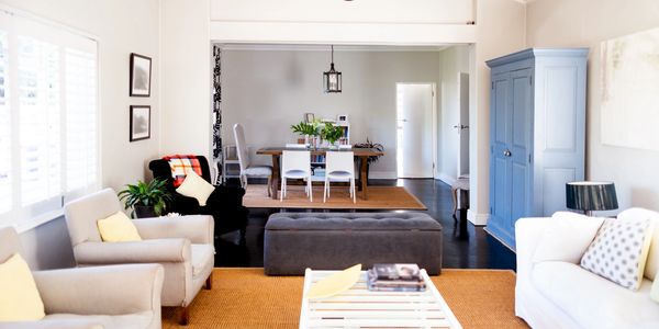 Bright and cozy living room with neutral tones and blue accents.