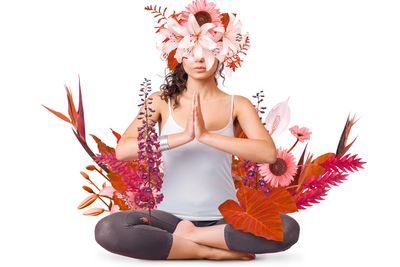 Woman meditating with floral elements surrounding her.