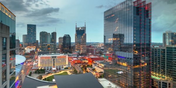 City skyline with modern skyscrapers during dusk.