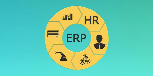 A serene landscape featuring mountains, a lake, and a clear blue sky.