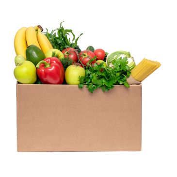 A box filled with fresh fruits, vegetables, and pasta.