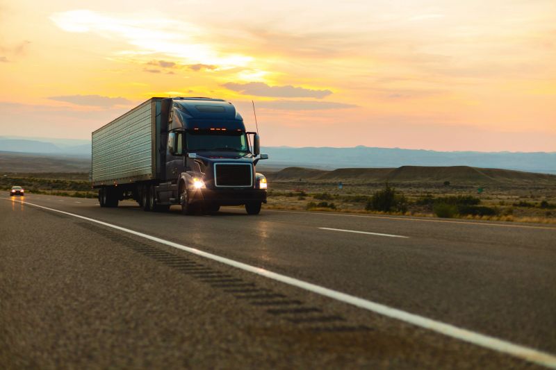 Automobiles and Commercial Semi Truck Cargo Transport Hauling Freight Interstate Highway Travel in the Western USA at Dusk During Golden Hour with Hazy Skies from Forest Fires Highway POV Matching 4K Video Available (Shot with Canon 5DS 50.6mp photos professionally retouched - Lightroom / Photoshop - original size 5792 x 8688 downsampled as needed for clarity and select focus used for dramatic effect)