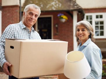Senior woman with family member reviewing moving plans in Richmond VA
