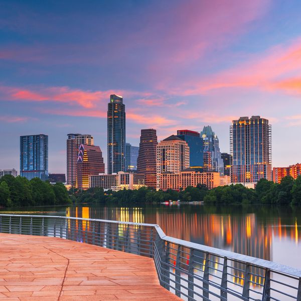 Austin skyline at sunset near major convention venues and corporate event spaces.
