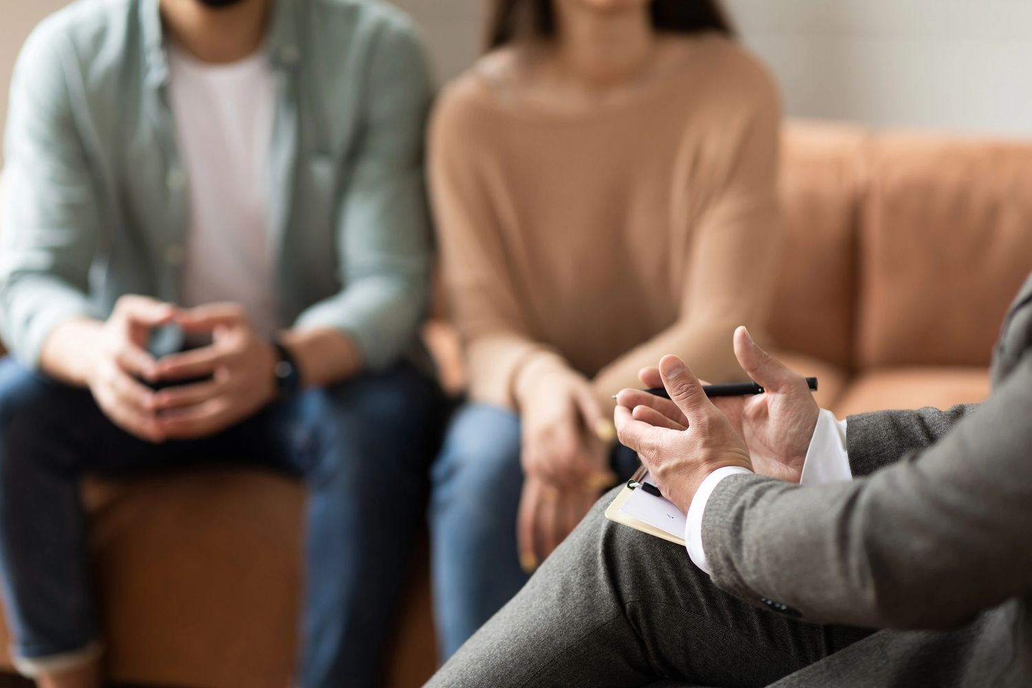 Couple consulting with a professional in a counseling session.