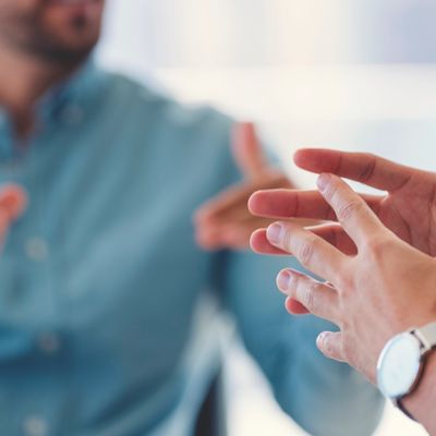 Close-up of hands gesturing during a conversation.
