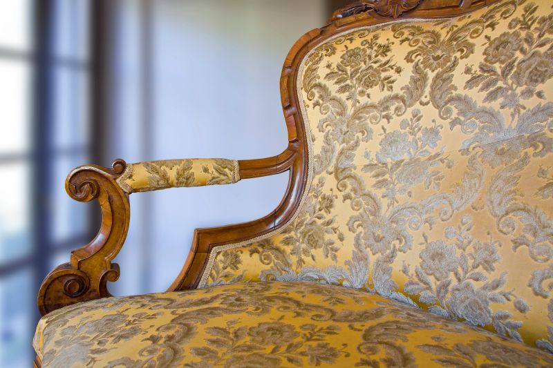 Detail of an antique traditional wooden italian furniture just restored with floral decorations.
