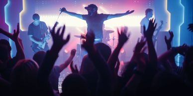 Band performing live with an energetic crowd.