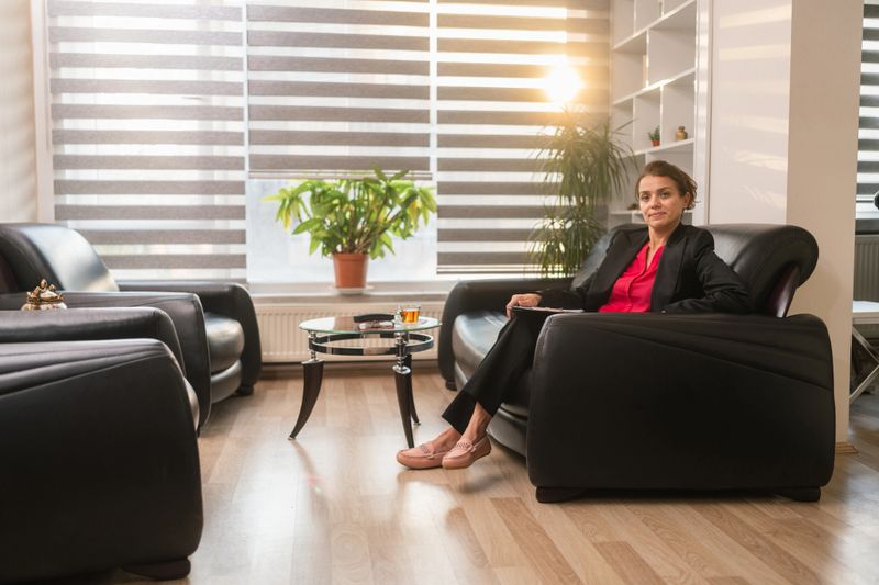 A portrait of a professional female mental health doctor at her office.