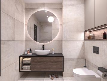 Modern bathroom with round mirror, floating wooden vanity, and minimalist design.
