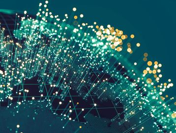 Abstract digital network with glowing nodes and connecting lines in teal and gold.