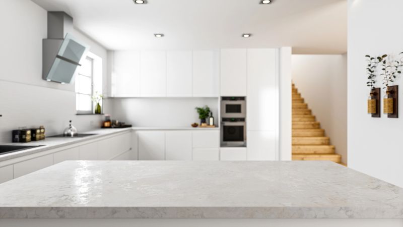 Empty white stone kitchen countertop with copyspace. Focus on foreground.