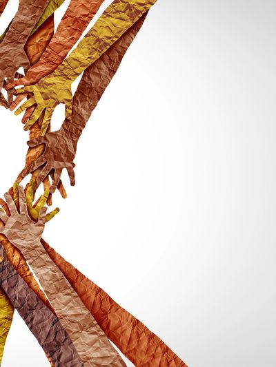 Diverse hands forming a heart shape symbolizing unity and love.