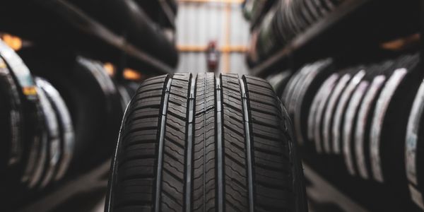 Close-up of a tire tread in a tire shop aisle.