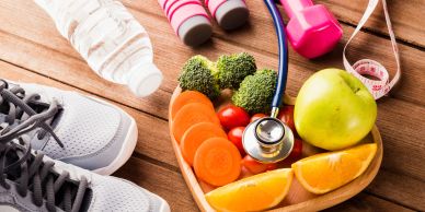 Healthy lifestyle items including fruits, vegetables, and sports equipment.