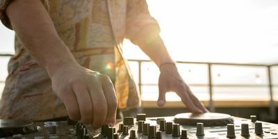 Man DJing on a rooftop