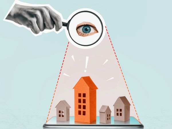 Eye inspecting a highlighted house model on a smartphone screen.