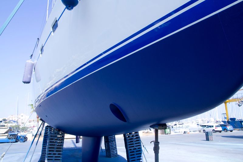 boat hull sailboat blue antifouling beached for paint works