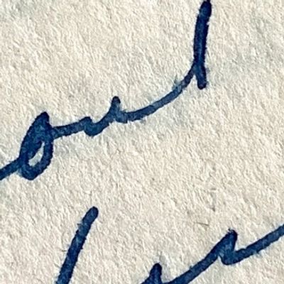Close-up of handwritten cursive text on paper.