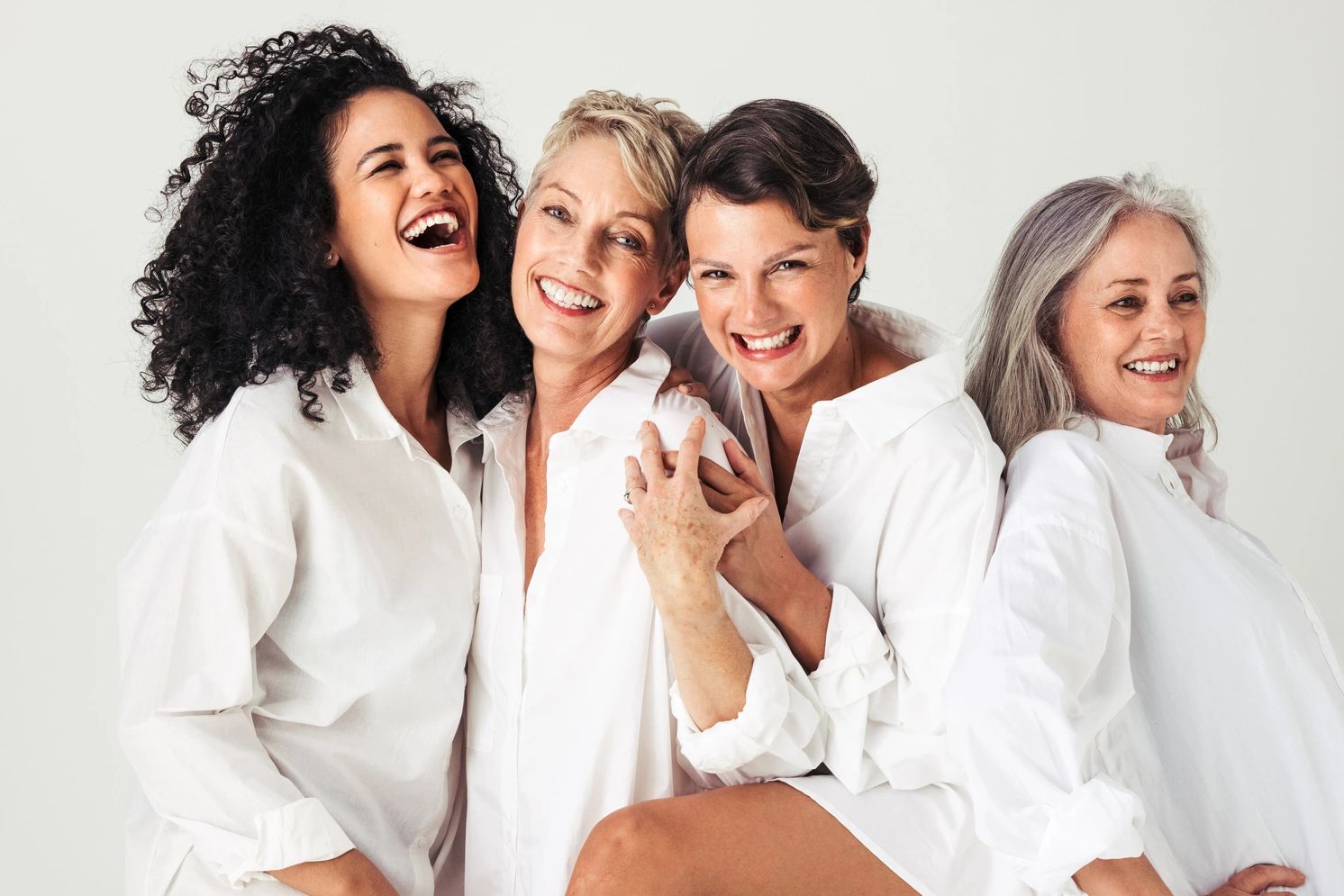 Happy women of all ages, showing their self-confidence thanks to HA Filler & Botox treatments.