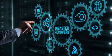 Hand pointing to digital gears labeled 'Disaster Recovery' and related icons.