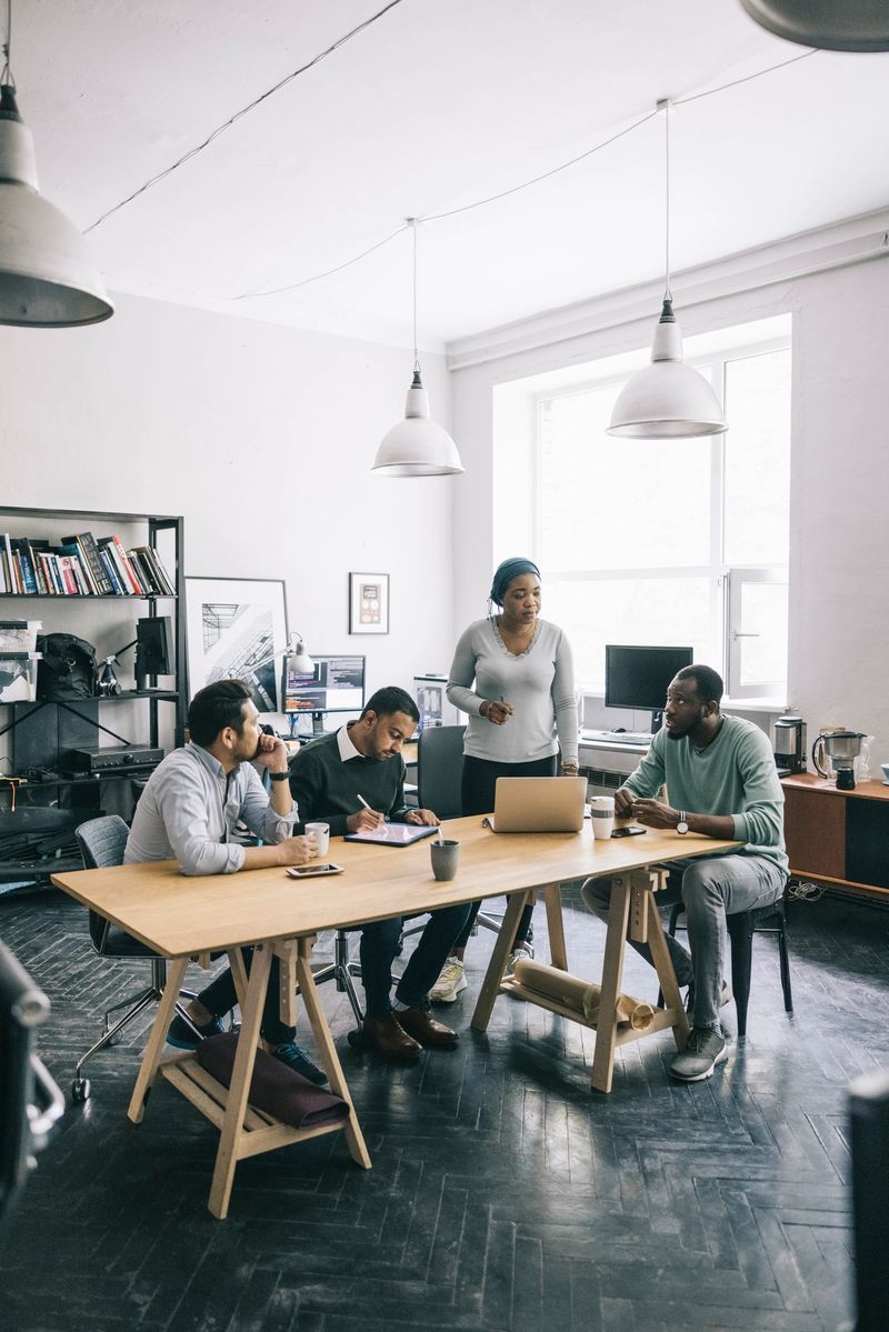 Group of architects having a meeting in open plan office.