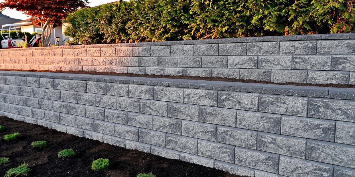 Block retaining wall installation in Murrieta, tiered wall structure built by BluCrew Landscape