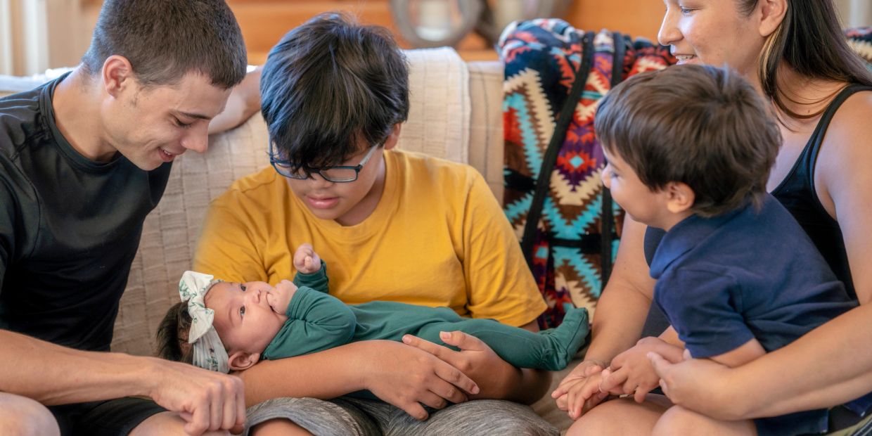 Family bonding moment with a newborn baby.