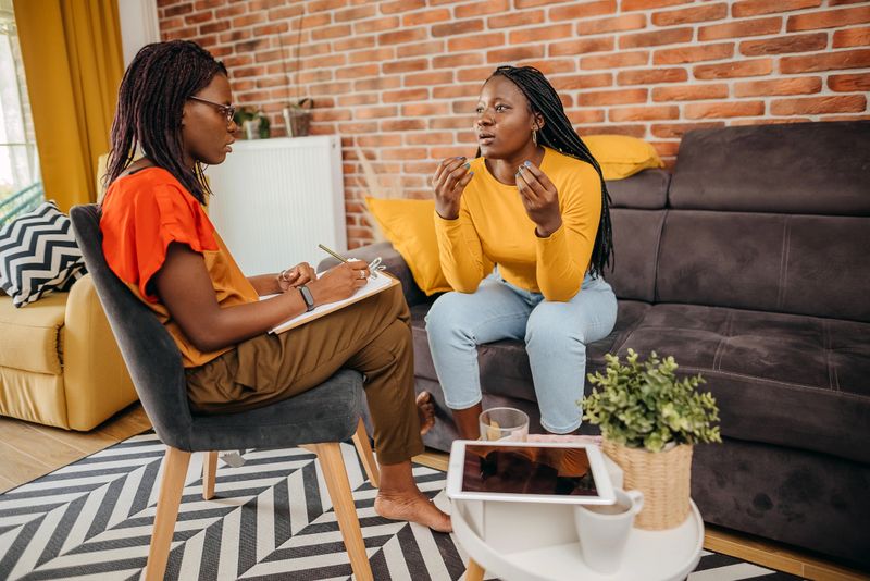 Therapist trying to help to young woman