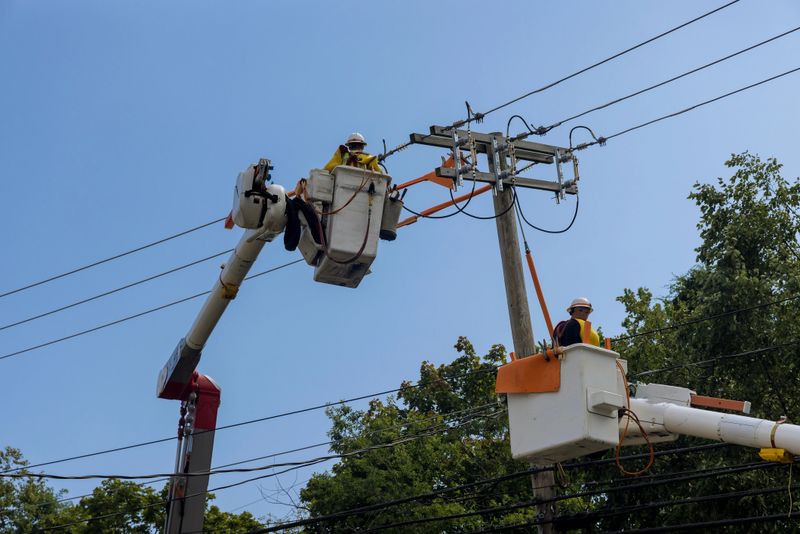 After hurricane of service men working power electrical lines support handling damage