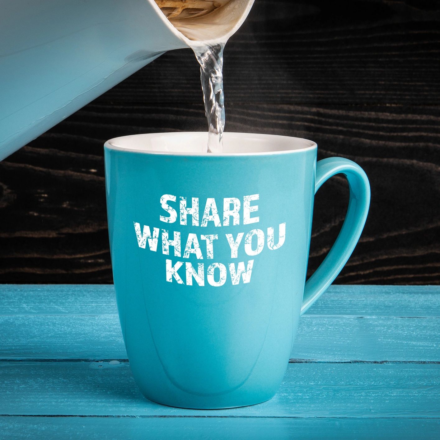 Water pouring into mug that says "share what you know"