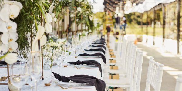 Luxurious event setup with flowers and sophisticated decor.