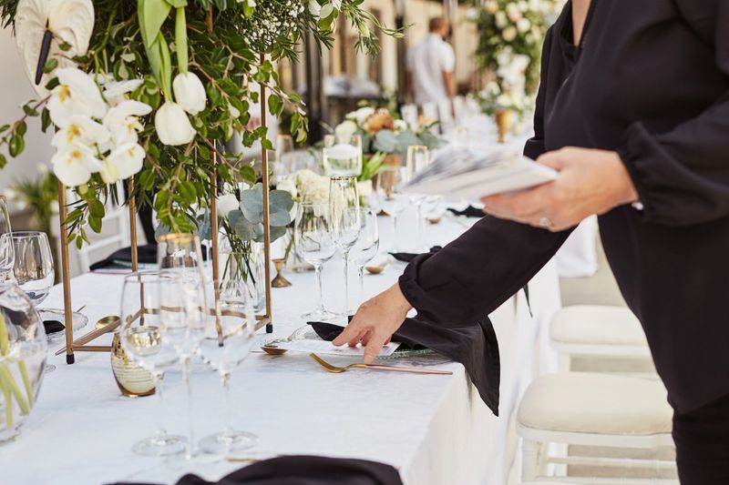 Luxurious bartending setup with elegant glassware and upscale decor at an exclusive event.