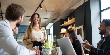 A woman leading a meeting with engaged colleagues.