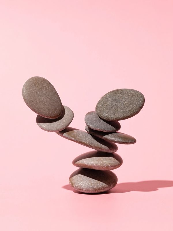 A stack of pepples representing support offered in our Autism and ADHD informed counselling sessions