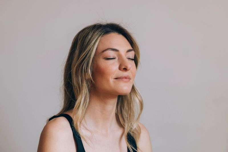 Portrait of a beautiful young smiling Caucasian woman in sports shirt