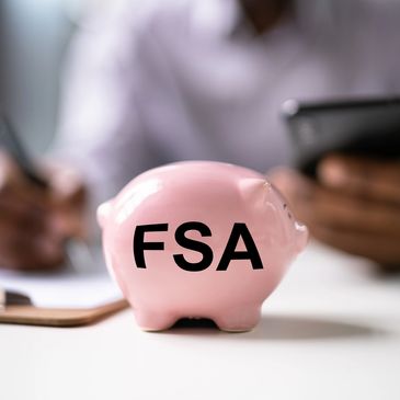Piggy bank labeled FSA symbolizing using pre-tax funds for wellness services.